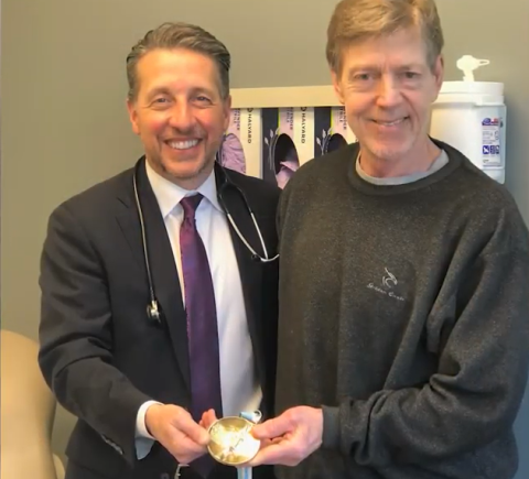 Doctor and Eric holding gold medal