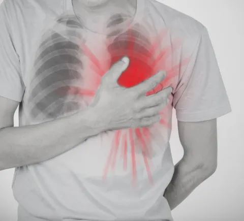 patient grabbing chest
