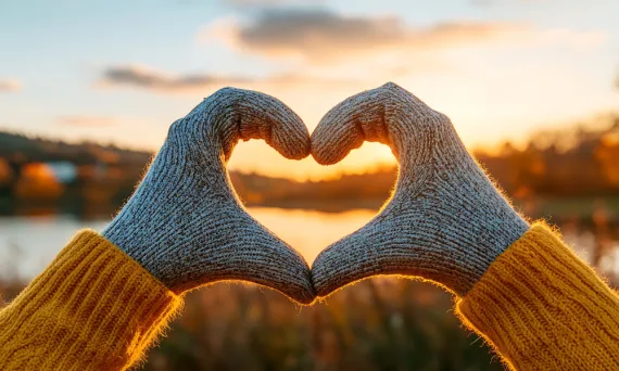 gloved hands making a heart shape
