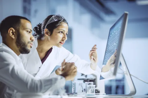 Lab-techs-looking-at-computer