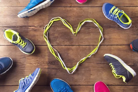 running shoes and heart in shoelaces