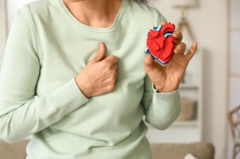 woman holding heart