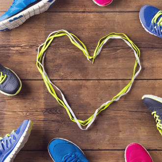 running shoes and heart in shoelaces
