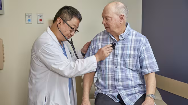 doctor listening to heart