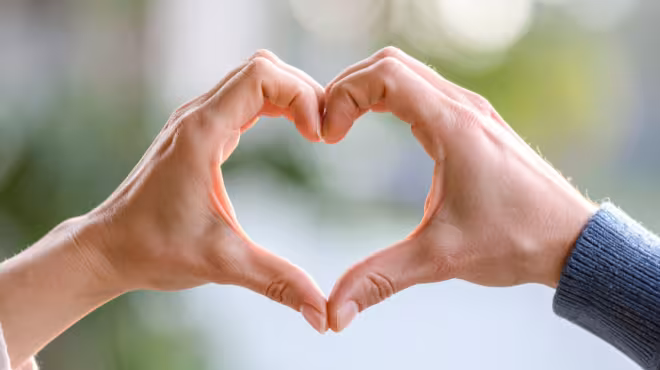 making a heart with hands