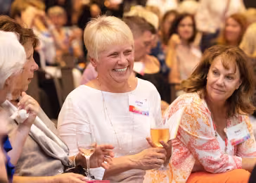 woman smiling in crowd