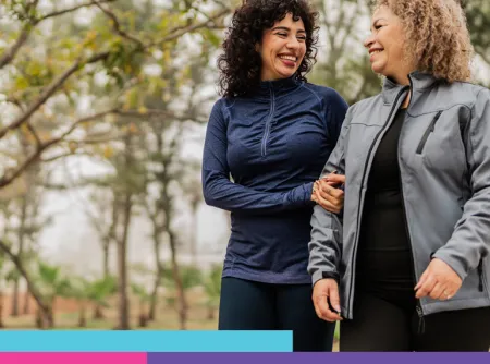 Image depicting a mother and daughter walking through the woods